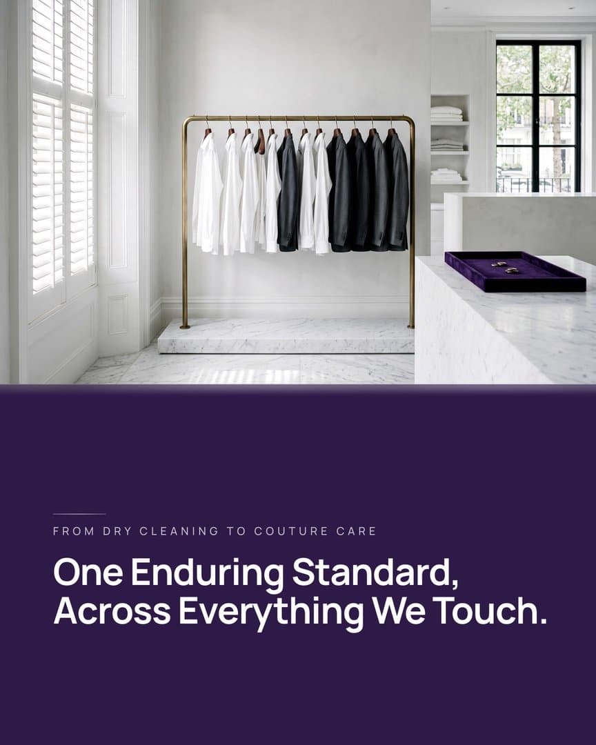 Ad still: white shirts and dark jackets on a brass rail in a white marble room, line From dry cleaning to couture care, headline One Enduring Standard, Across Everything We Touch.